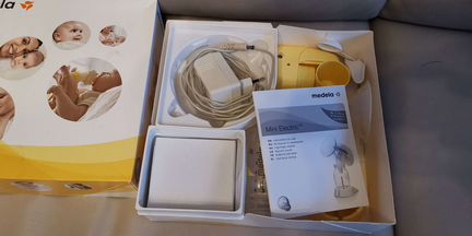 Молокоотсос Medela mini electric